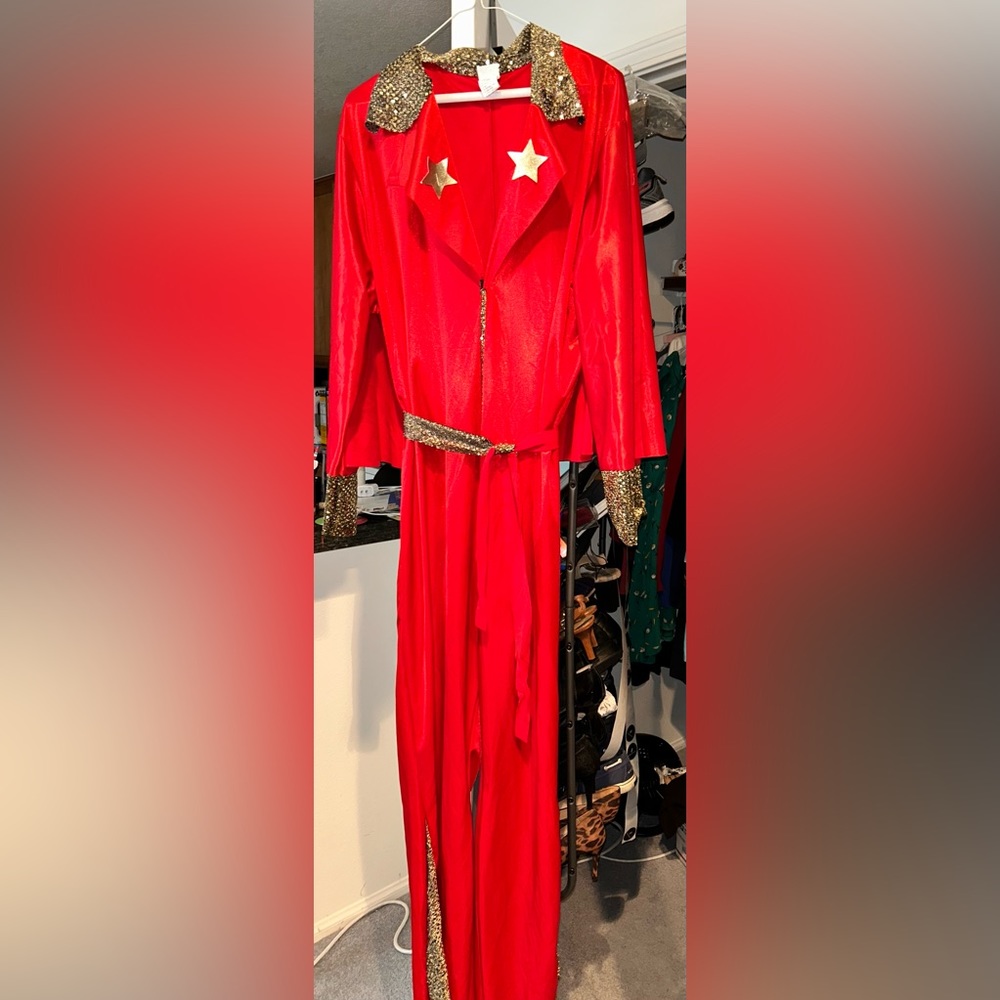 Red rocker jumpsuit costume with gold tone stars and trim (one size )